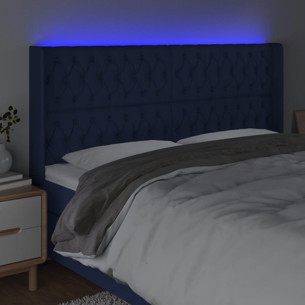 sengegavl med LED-lys 203x16x118/128 cm stof blå